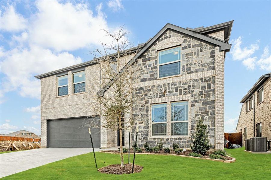 Front exterior of a new home in Eagle Glen Elements, Alvarado, TX, highlighting curb appeal (Image 1). Front exterior of a new home in Eagle Glen Elements, Alvarado, TX, highlighting curb appeal (Image 1).