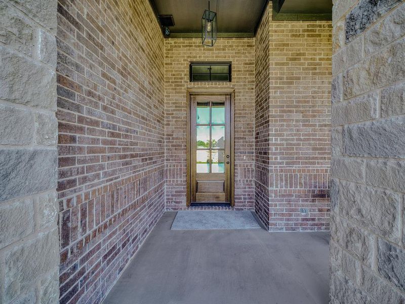 View of exterior entry with brick siding View of exterior entry with brick siding