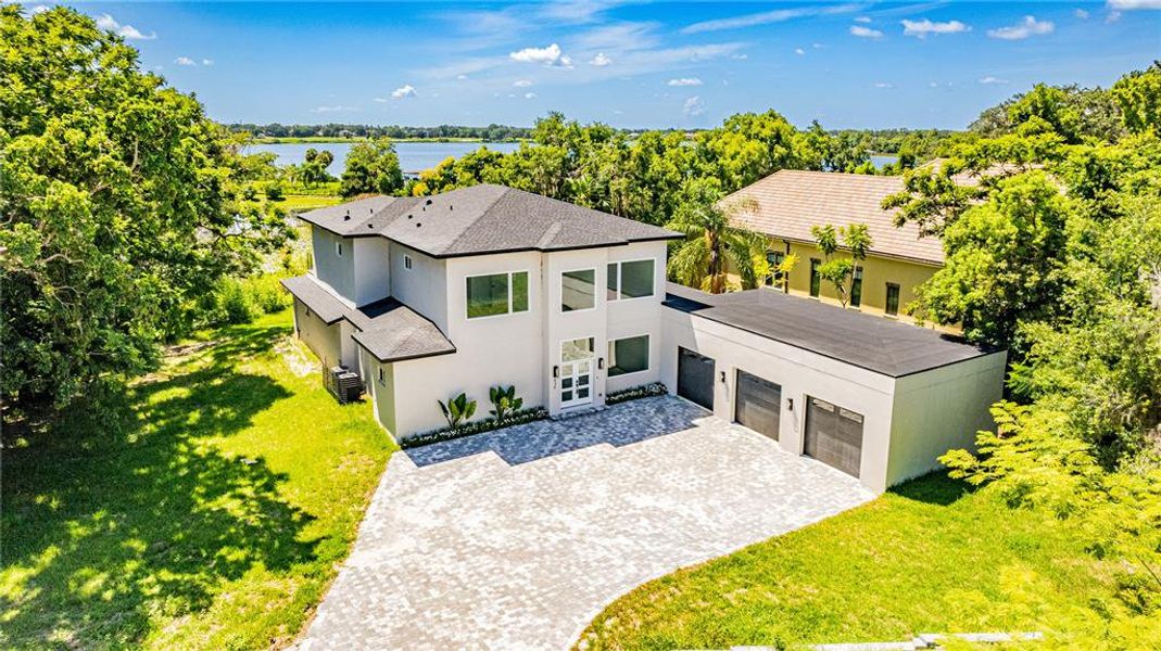 Front exterior of a new home in , Windermere, FL, highlighting curb appeal (Image 22).