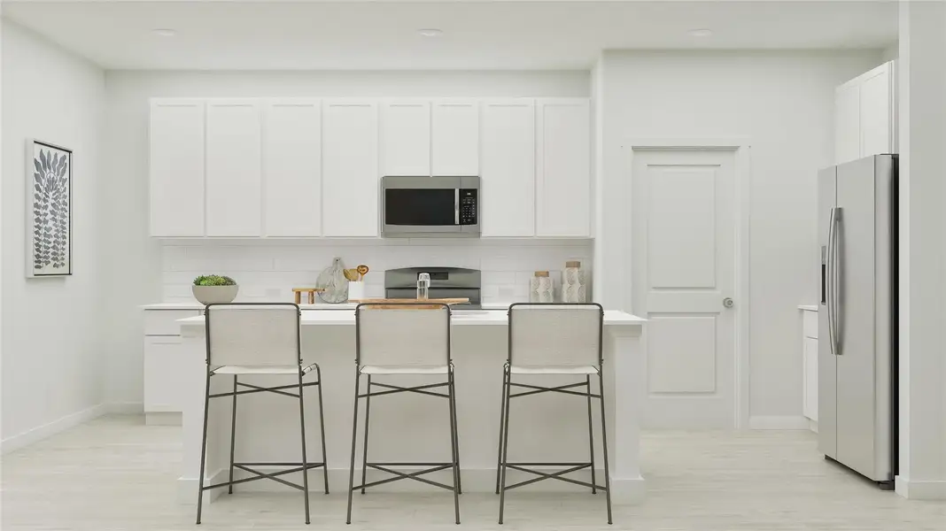 Kitchen featuring tasteful backsplash, a kitchen bar, stainless steel appliances, an island with sink, and recessed lighting Kitchen featuring tasteful backsplash, a kitchen bar, stainless steel appliances, an island with sink, and recessed lighting