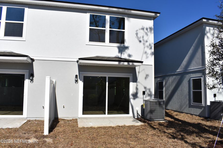 Exterior details and patio area of a home in Irongate Villas, Jacksonville (Image 2).