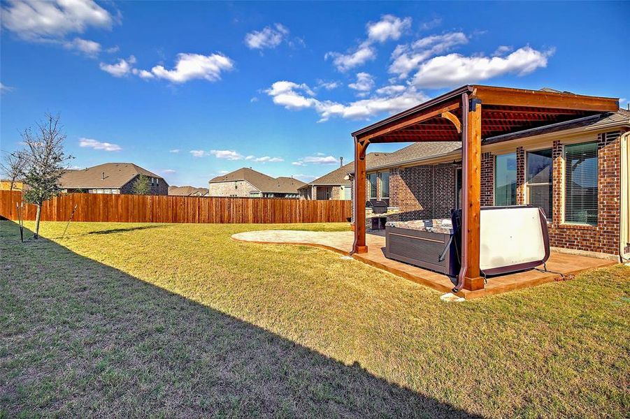 Oversized grassy backyard.