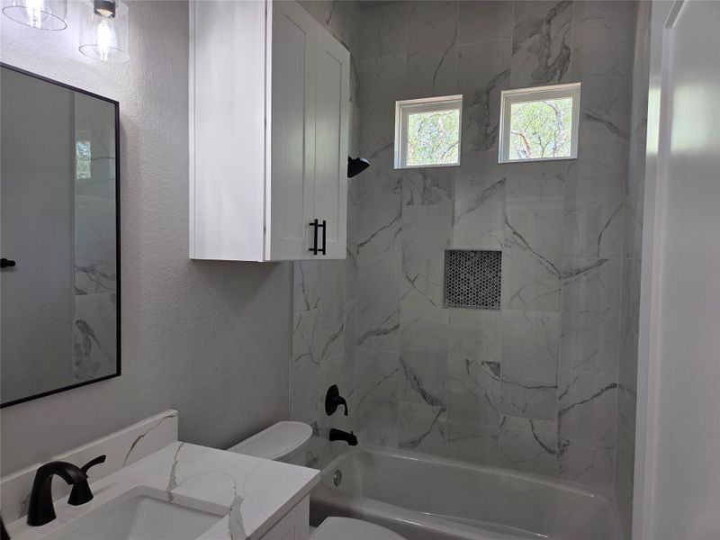 Bathroom featuring vanity, tub / shower combination Bathroom featuring vanity, tub / shower combination