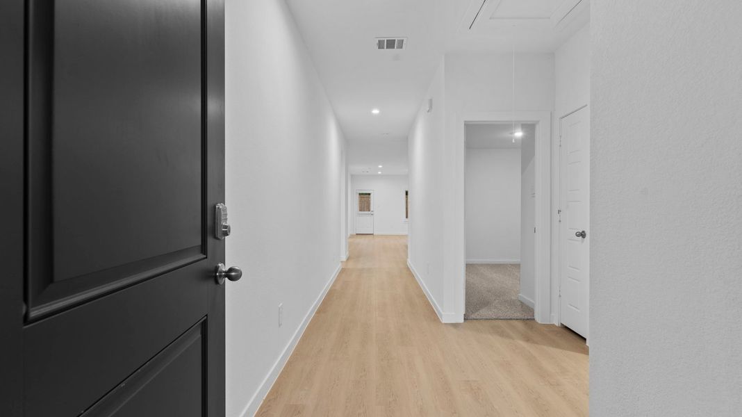 Spacious, unfurnished interior of a new home in Caldwell Crossing, Iowa Colony (Image 12).