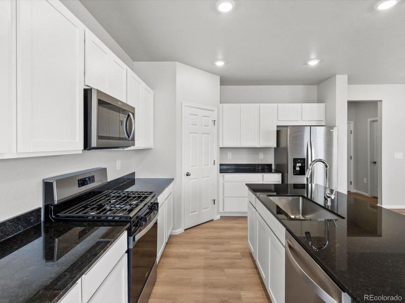 Furnished interior view inside a new home in Lake Bluff, Greeley (Image 7).