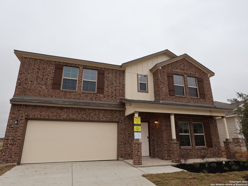 Front exterior of a new home in Paloma Park, Converse, TX, highlighting curb appeal (Image 23).