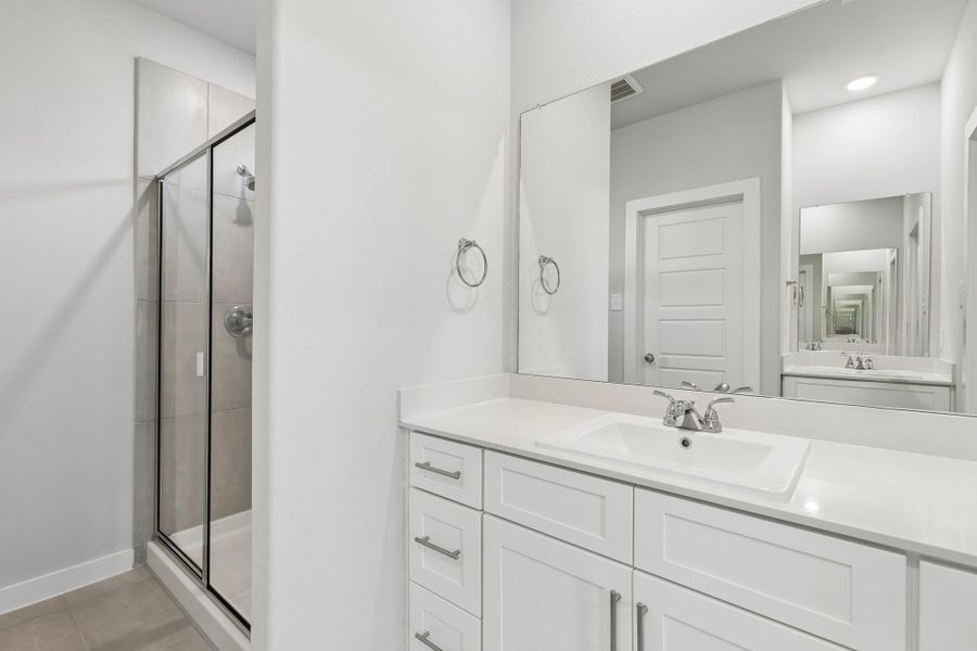 Primary Bathroom in the Cypress home plan by Trophy Signature Homes - REPRESENTATIVE PHOTO