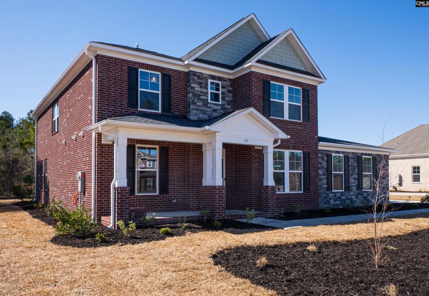 Front exterior of a new home in The Cove, Sumter, SC, highlighting curb appeal (Image 2).