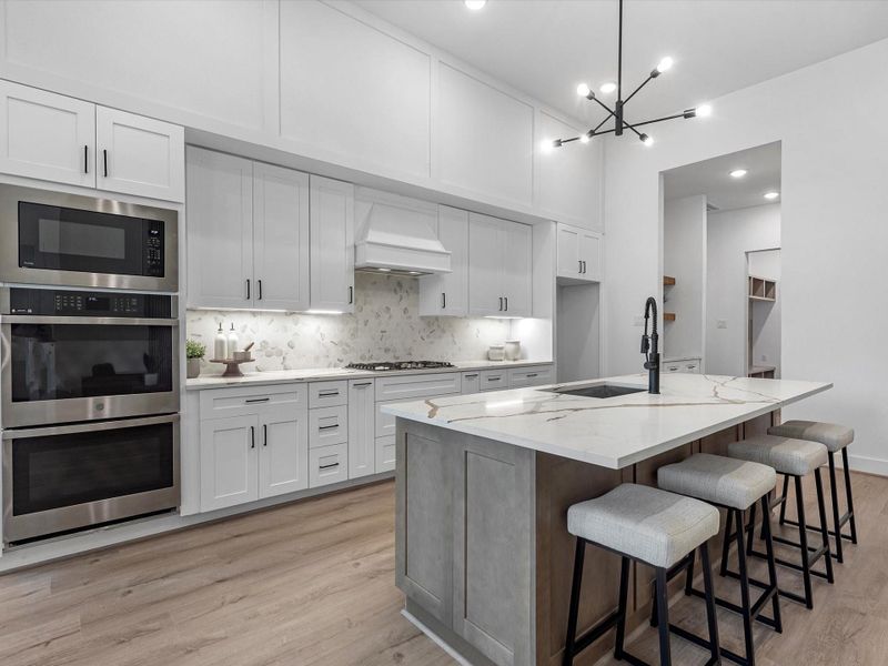 Built-in, stainless GE appliances with a double oven and gas cooktop Built-in, stainless GE appliances with a double oven and gas cooktop