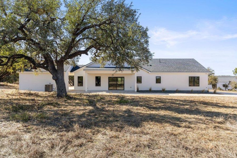 Back of house. Large back yard with beautiful, unobstructed hill country views.