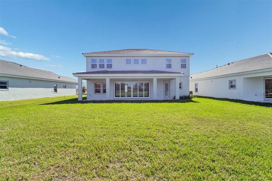 Exterior details and patio area of a home in North River Ranch, Parrish (Image 3).