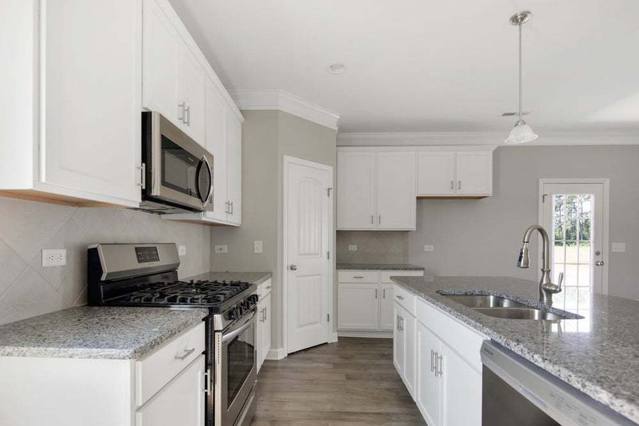 Representative furnished interior of a home built from the Aberdeen by Caviness & Cates Communities in Bartlett Manor, Youngsville (Image 42).