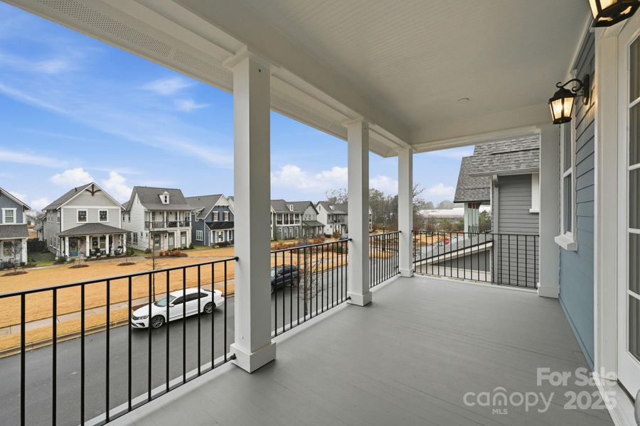 A warm and inviting upper-level front porch, perfect for rocking chairs and enjoying Promenade Park. A warm and inviting upper-level front porch, perfect for rocking chairs and enjoying Promenade Park.