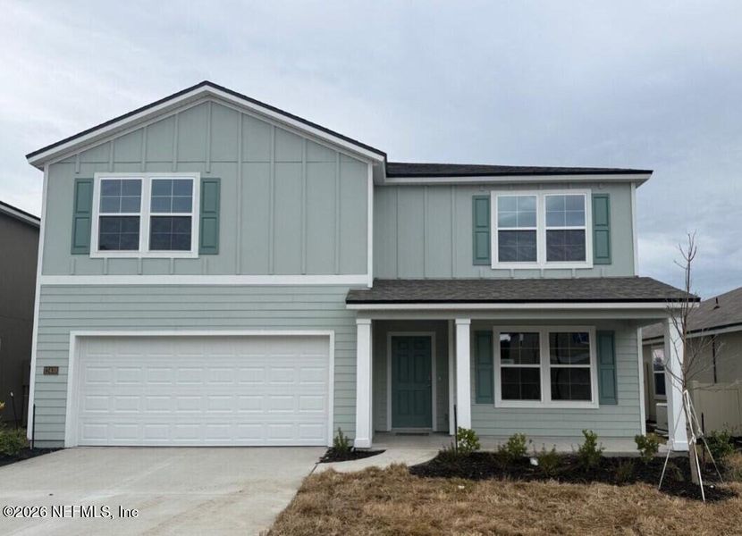Front exterior of a new home in The Arbors, Jacksonville, FL, highlighting curb appeal (Image 1). Front exterior of a new home in The Arbors, Jacksonville, FL, highlighting curb appeal (Image 1).