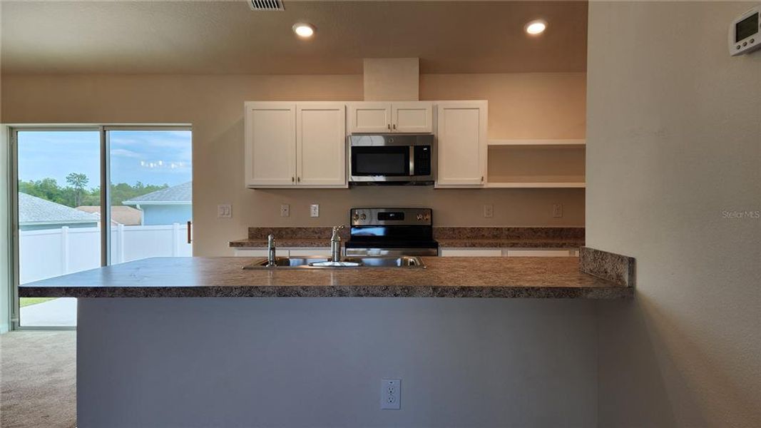 Furnished interior view inside a new home in , Dunnellon (Image 8).