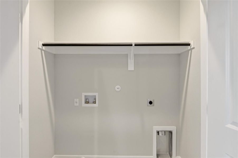 Washroom with hookup for a gas dryer, washer hookup, and hookup for an electric dryer Washroom with hookup for a gas dryer, washer hookup, and hookup for an electric dryer