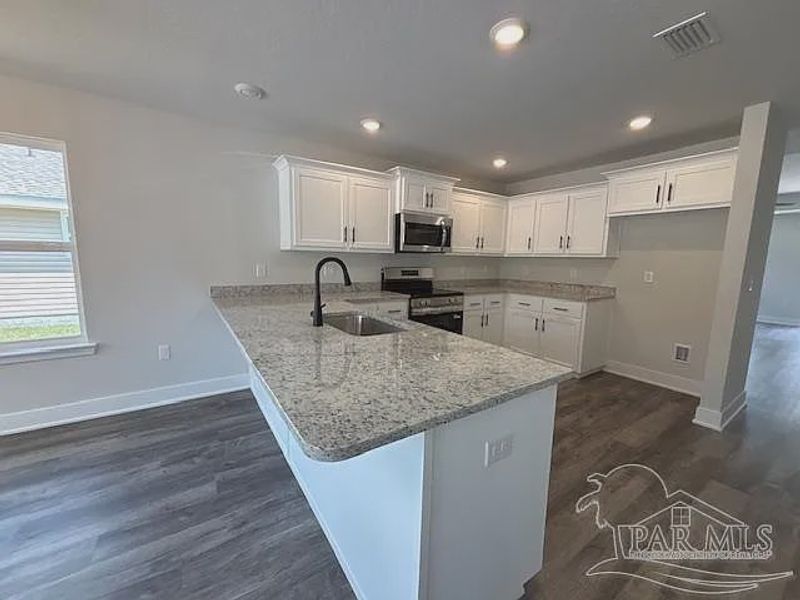 Furnished interior view inside a new home in Turtle Creek, Cantonment (Image 3).