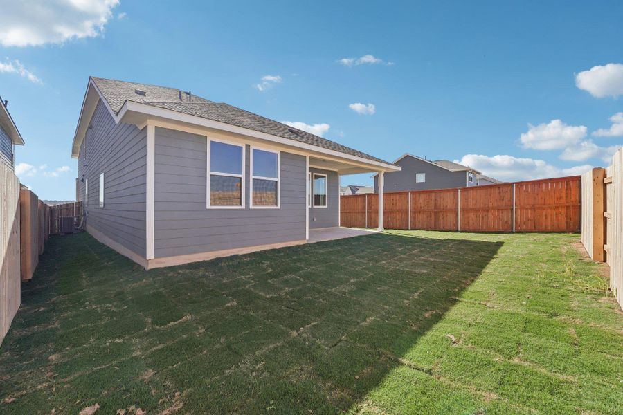 Exterior details and patio area of a home in The Homestead at Lariat, Liberty Hill (Image 13).