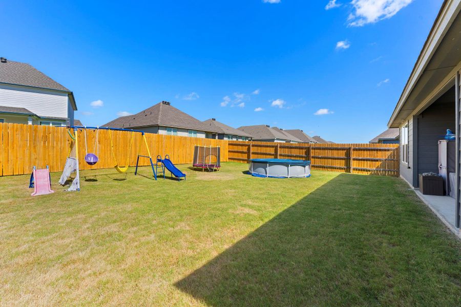 A spacious, enclosed yard provides a private haven for recreation. A spacious, enclosed yard provides a private haven for recreation.