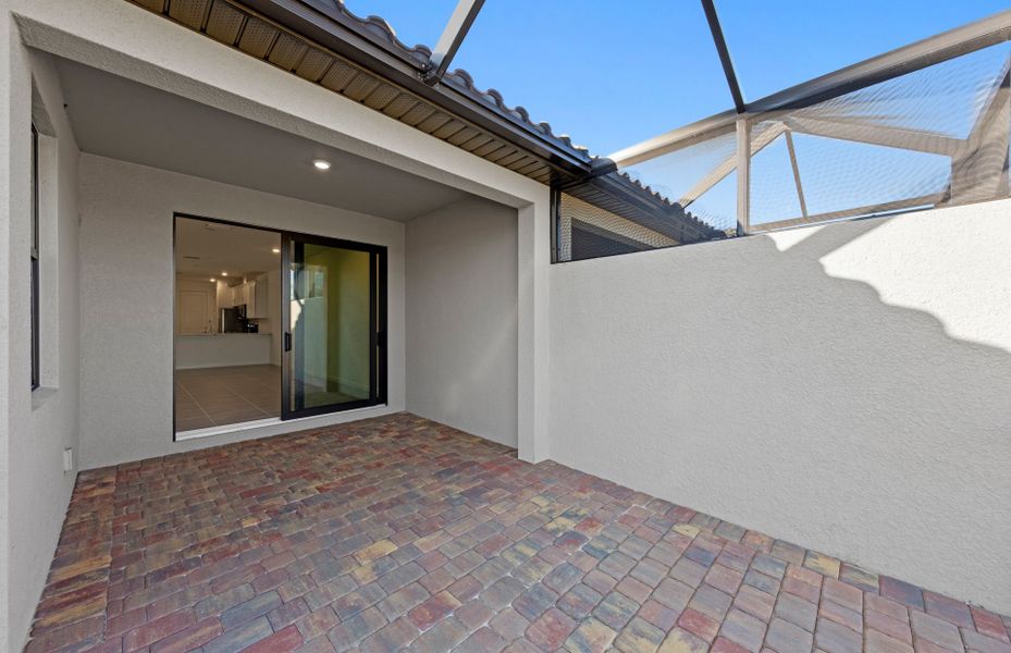 Exterior details and patio area of a home in Del Webb Naples, Ave Maria (Image 3).