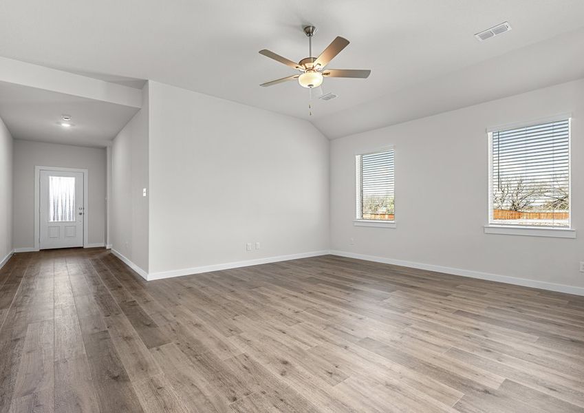 The living room has a two large windows that lets in great, natural light.