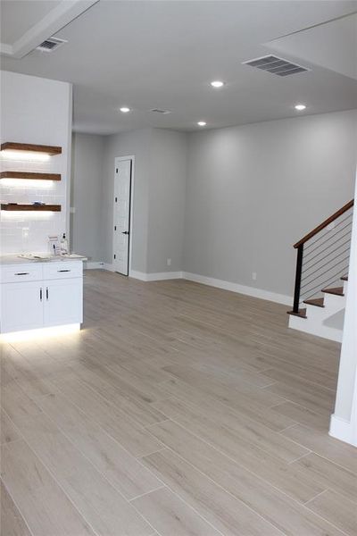 Unfurnished living room featuring light hardwood / wood-style flooring