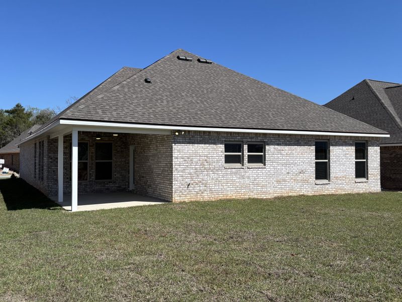 Exterior details and patio area of a home in Bird Song at Hammock Bay, Freeport (Image 22).