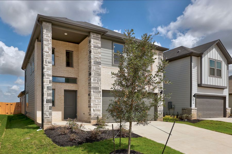 Front exterior of a new home in Trinity Ranch, Elgin, TX, highlighting curb appeal (Image 21).