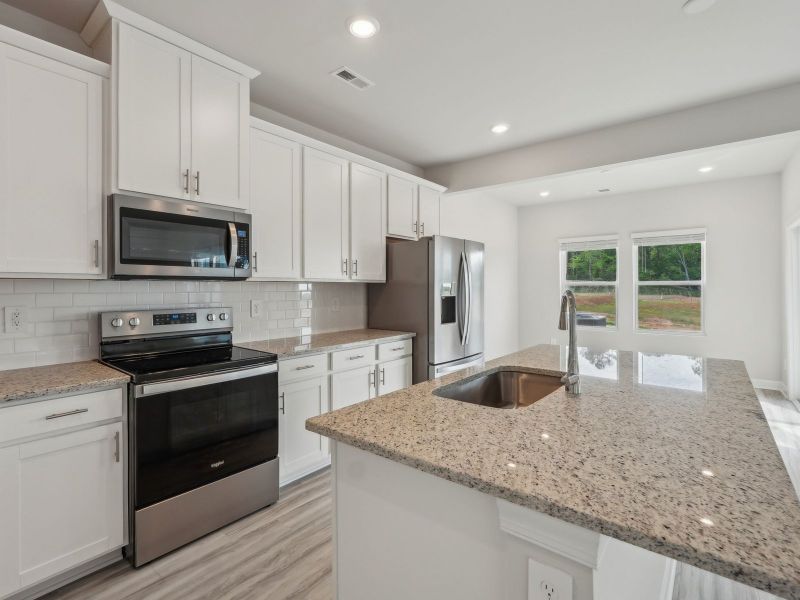 Furnished interior view inside a new home in Walnut Reserve, Conover (Image 4).