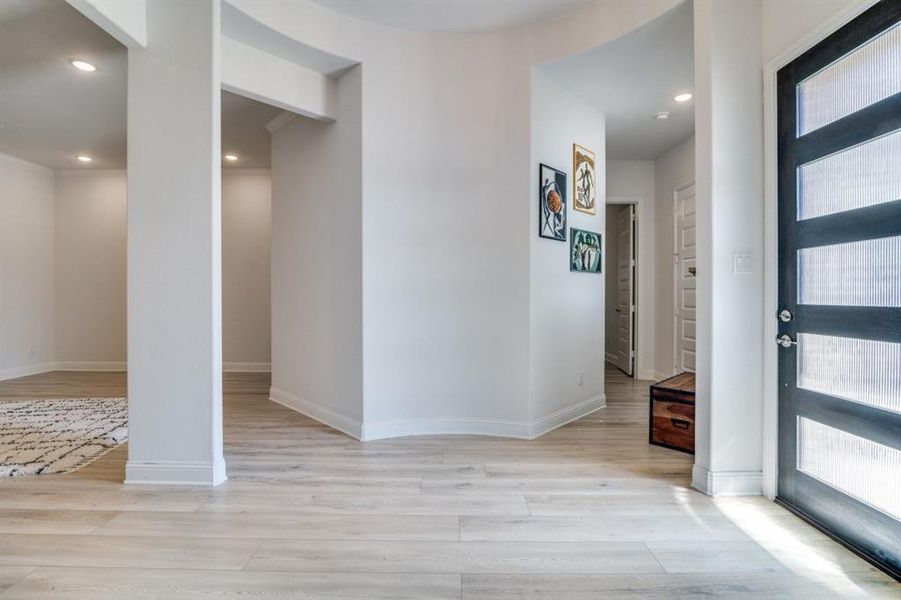 Foyer entrance featuring recessed lighting, a healthy amount of sunlight, and light wood-type flooring Foyer entrance featuring recessed lighting, a healthy amount of sunlight, and light wood-type flooring