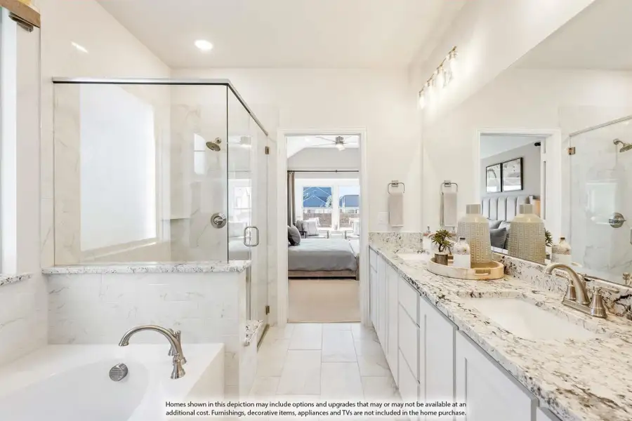 Master bathroom with double vanity, granite countertops, glass shower, and soaking tub with marble tile surround