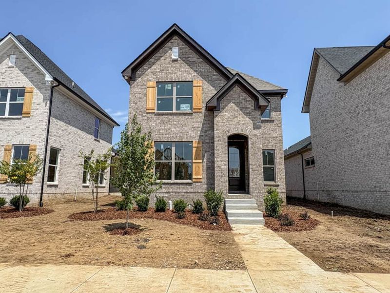 Front exterior of a new home in , Gallatin, TN, highlighting curb appeal (Image 1). Front exterior of a new home in , Gallatin, TN, highlighting curb appeal (Image 1).