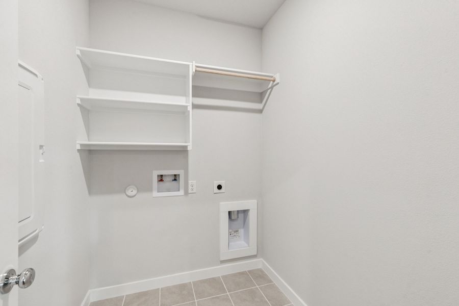 Utility Room in the Oscar home plan by Trophy Signature Homes – REPRESENTATIVE PHOTO