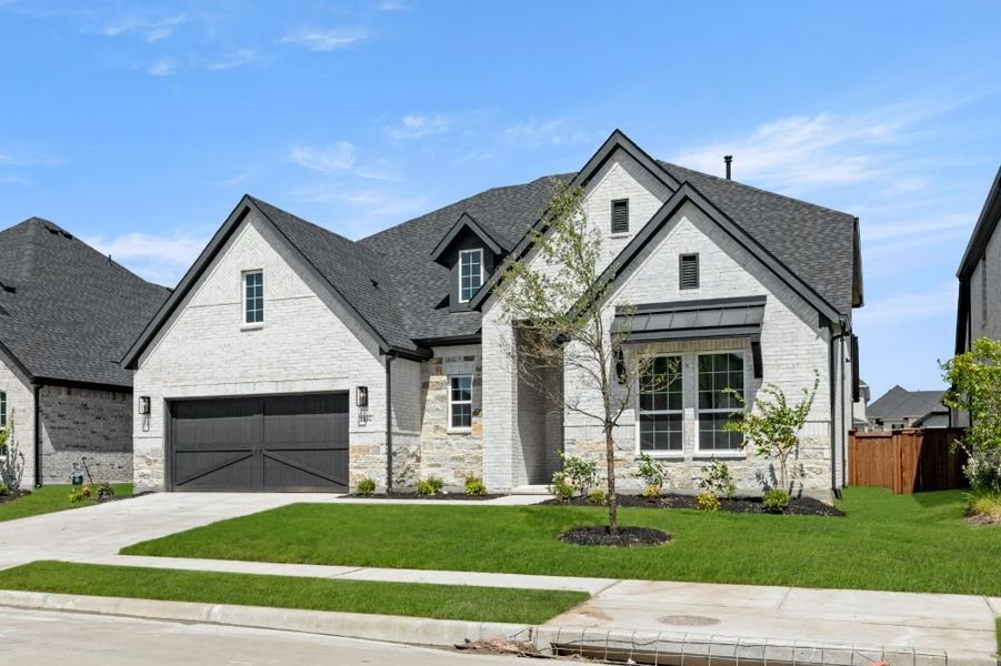 Front exterior of a new home in Cambridge Crossing, Celina, TX, highlighting curb appeal (Image 27). Front exterior of a new home in Cambridge Crossing, Celina, TX, highlighting curb appeal (Image 27).