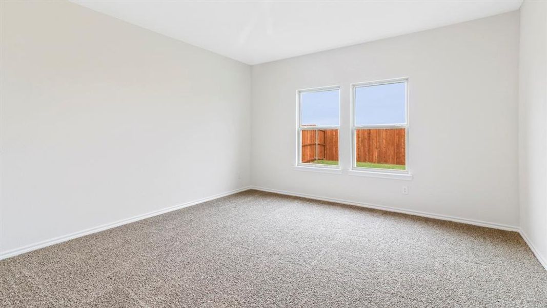 Neutral-toned walls complement plush carpeting