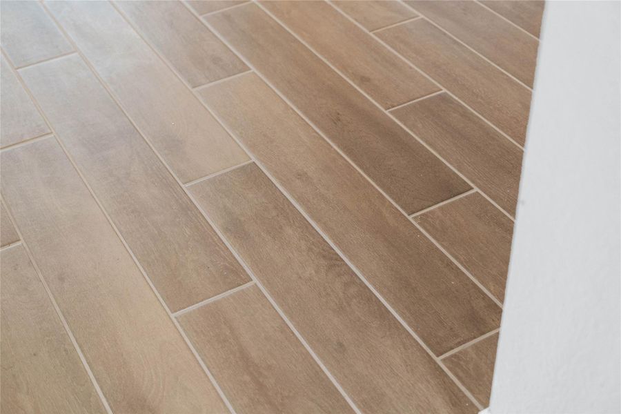 Wood-look tile flooring.