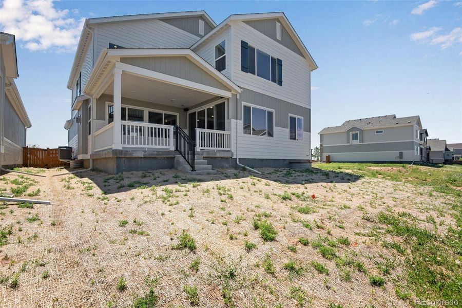 Front exterior of a new home in Reunion Ridge, Commerce City, CO, highlighting curb appeal (Image 24).