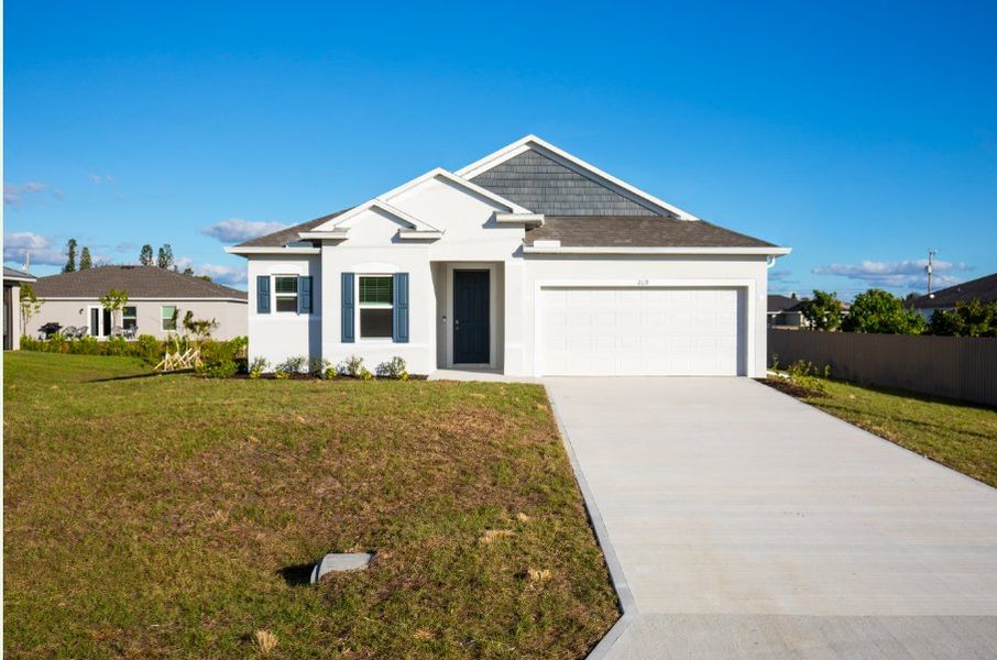 Front exterior of a new home in Burnt Store, Cape Coral, FL, highlighting curb appeal (Image 1). Front exterior of a new home in Burnt Store, Cape Coral, FL, highlighting curb appeal (Image 1).