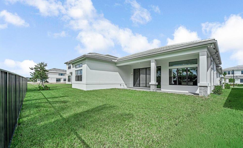 Front exterior of a new home in Apex at Avenir, Palm Beach Gardens, FL, highlighting curb appeal (Image 22). Front exterior of a new home in Apex at Avenir, Palm Beach Gardens, FL, highlighting curb appeal (Image 22).