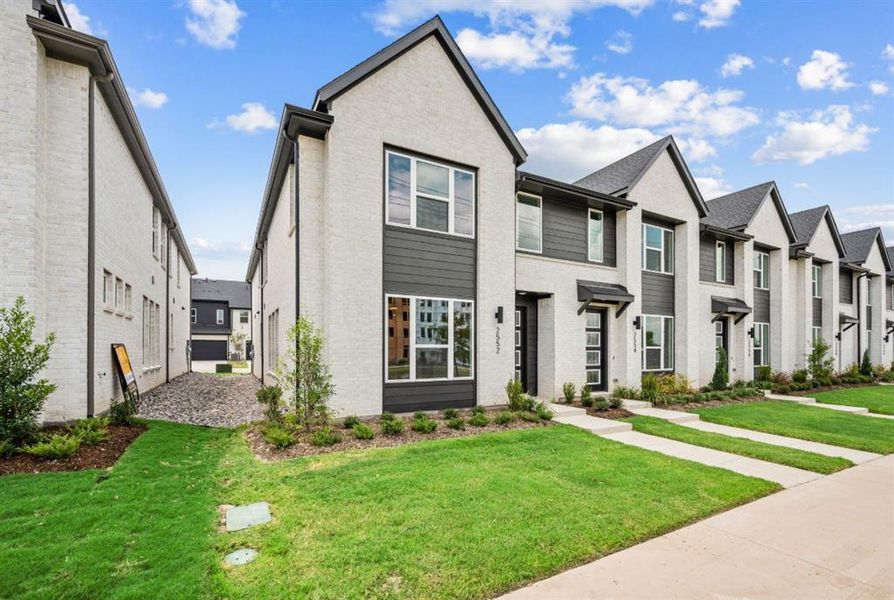 Front exterior of a new home in Chelsea Commons, Allen, TX, highlighting curb appeal (Image 1).
