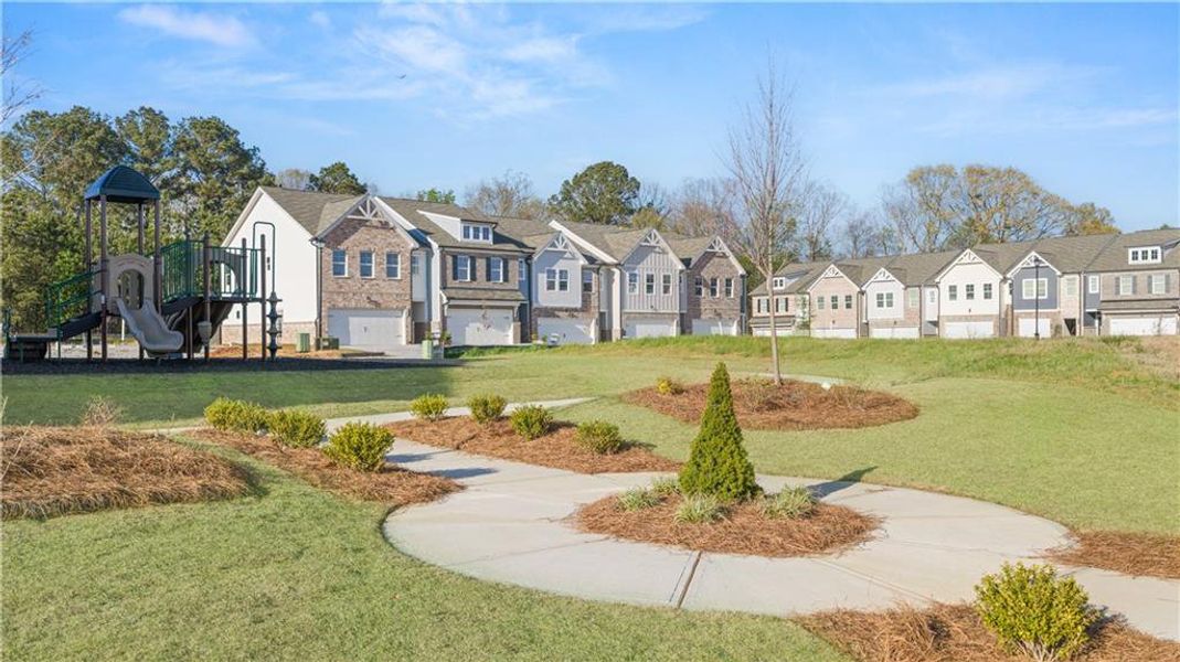 Front exterior of a new home in Union Village, McDonough, GA, highlighting curb appeal (Image 26).