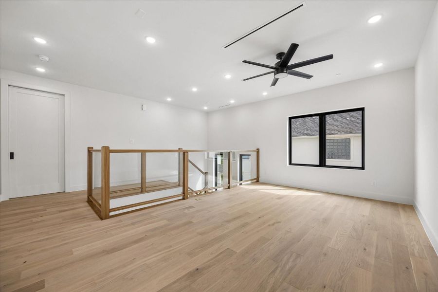 The Primary and the three upstairs secondary bedrooms convene at the Game room area, a private family gathering space.