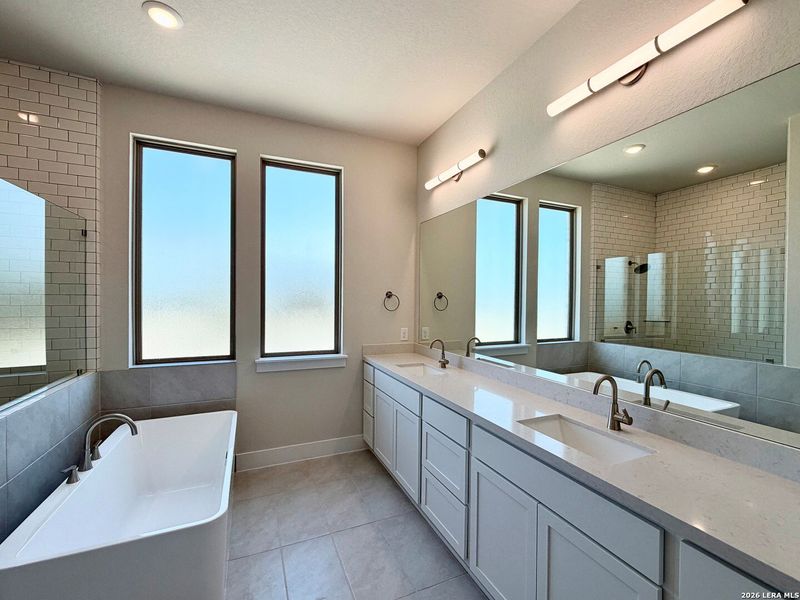 Furnished interior view inside a new home in Ladera - 60s, San Antonio (Image 9).