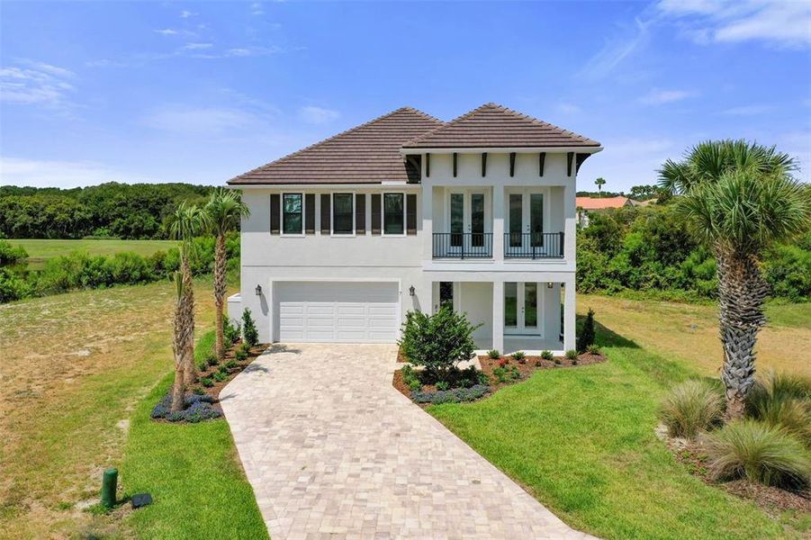 Front exterior of a new home in , Palm Coast, FL, highlighting curb appeal (Image 26). Front exterior of a new home in , Palm Coast, FL, highlighting curb appeal (Image 26).