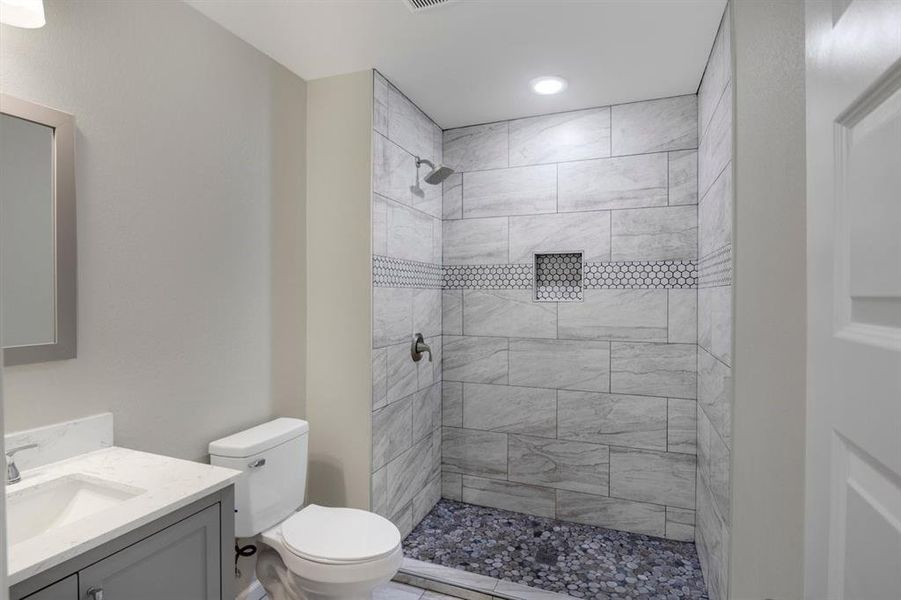 Full bathroom with vanity and a stall shower Full bathroom with vanity and a stall shower