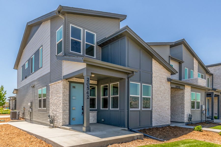 Front exterior of a new home in Painted Prairie, Aurora, CO, highlighting curb appeal (Image 21).