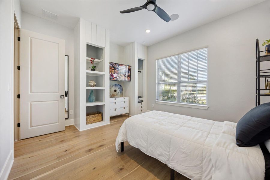 First level guest bedroom with custom built ins