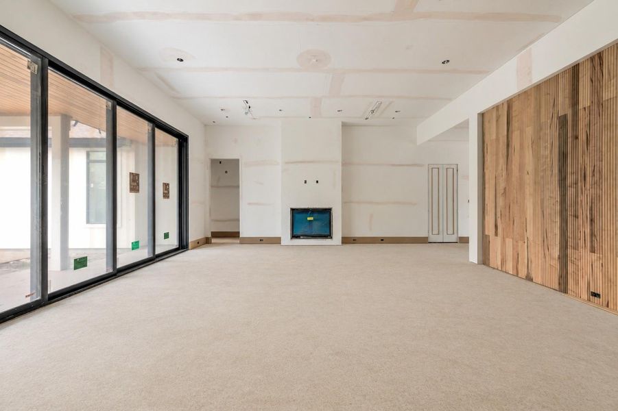 Great Room with 12 ft ceilings and beam accents to mirror Primary Bedroom Great Room with 12 ft ceilings and beam accents to mirror Primary Bedroom