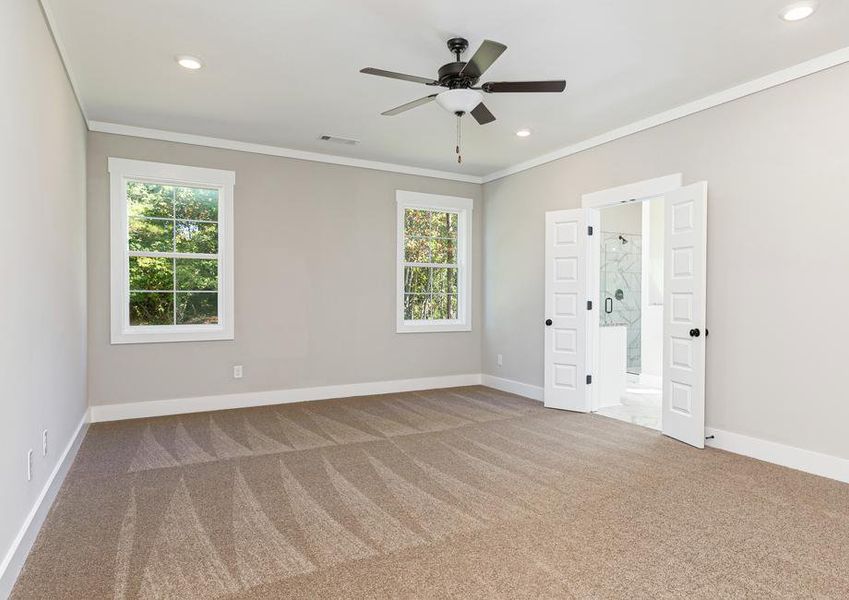 Master bedroom with a ceiling fan.