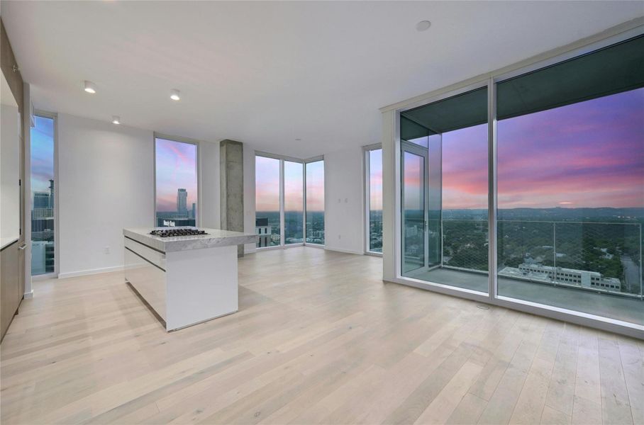 Floor-to-ceiling windows frame breathtaking nighttime views of the city, allowing you to cook and entertain with a stunning backdrop. The open concept design flows effortlessly into the living area, enhancing the space's overall sense of openness and light. Floor-to-ceiling windows frame breathtaking nighttime views of the city, allowing you to cook and entertain with a stunning backdrop. The open concept design flows effortlessly into the living area, enhancing the space's overall sense of openness and light.